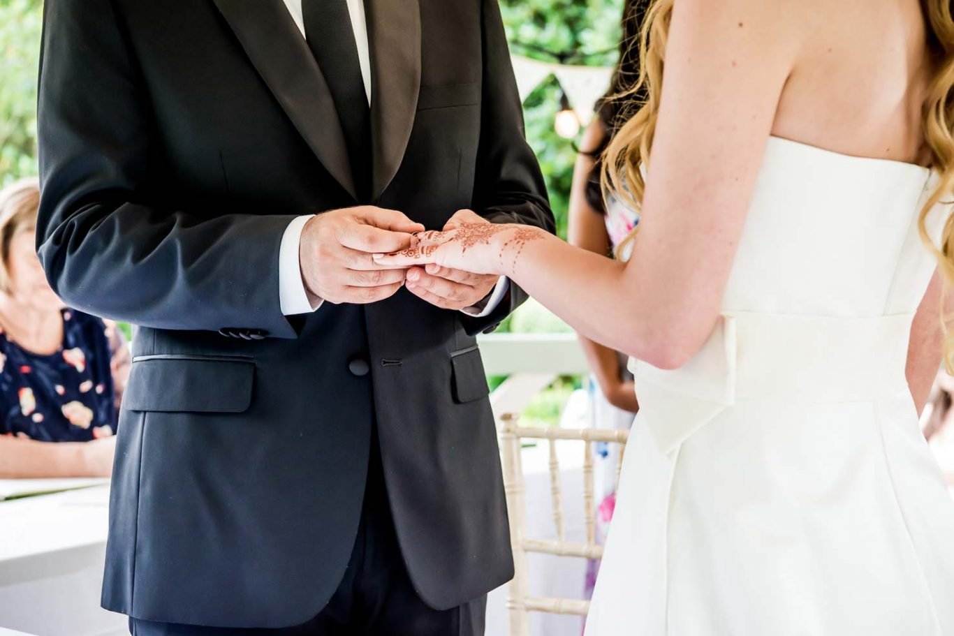 exchnaging rings wedding Ascot bride and groom